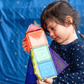 Child holding a small TileTek magnetic tile rocket built from coloured squares