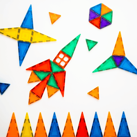 TileTek magnetic tile triangles arranged into stars, a hexagon and a rocket