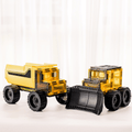 Magnetic tile dump truck and bulldozer standing side by side