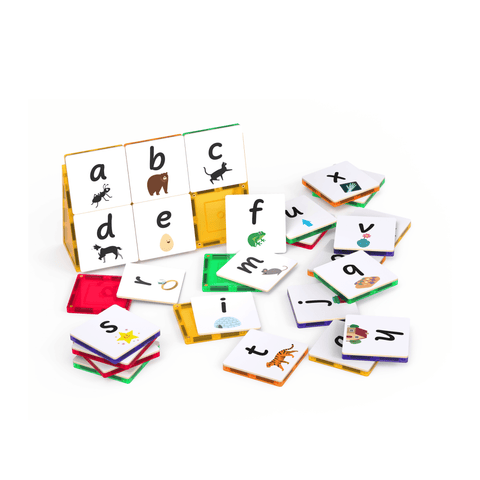 Tile Tek lower-case letter toppers scattered around a small magnetic tile build
