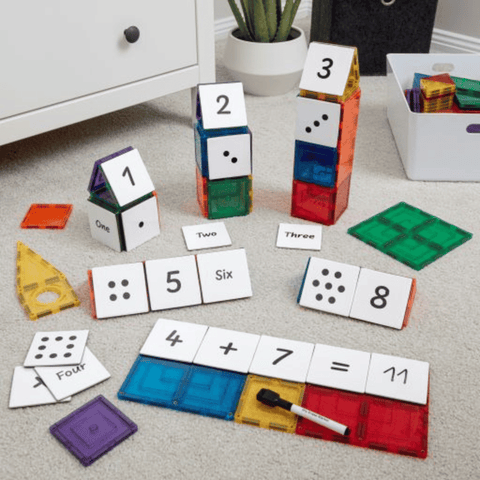 Tile Tek number toppers showing the worked equation 4 plus 7 equals 11