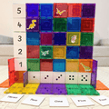 Magnetic tile wall decorated with Tile Tek number toppers and dinosaur stickers