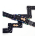 Close-up of interlocking Tile Tek road topper pieces with a toy car driving over tiles