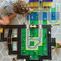 Aerial view of a child playing with combined Tile Tek road and rail toppers