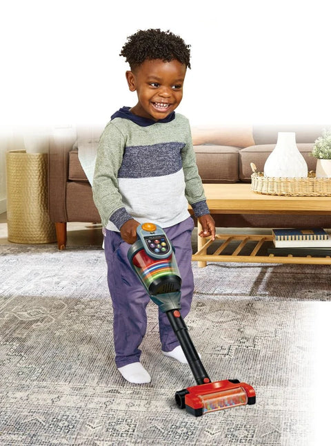 Toddler playing with the VTech Tidy Up Vacuum
