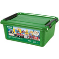 A green plastic storage box labeled "Brio World Cargo Railway Deluxe Set" from Brio features a colorful image of a toy train set complete with magnetic vehicles, tracks, and various accessories. Suitable for ages 3 and up, the box also has black handles on the sides.