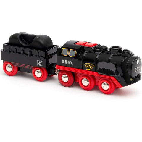 The Brio World Steaming Train is a small black and red toy train featuring a steam engine labeled "BRIO" and "H20." It includes a battery-powered engine with a black tanker car attached, equipped with red wheels. The sleek design fits perfectly on wooden train tracks, making it an excellent addition to any BRIO World set.