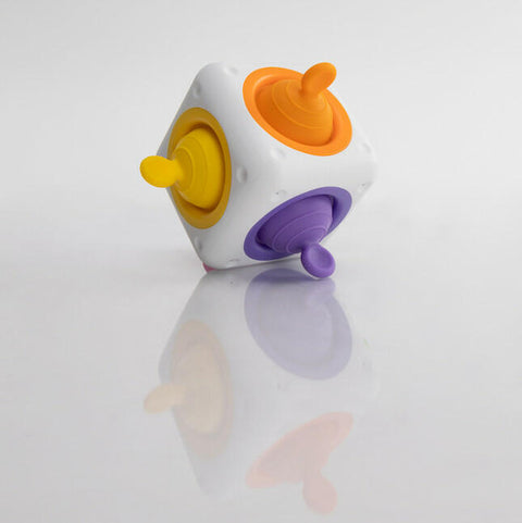 Fat Brain Tugl Cube showing silicone bubbles on multiple sides