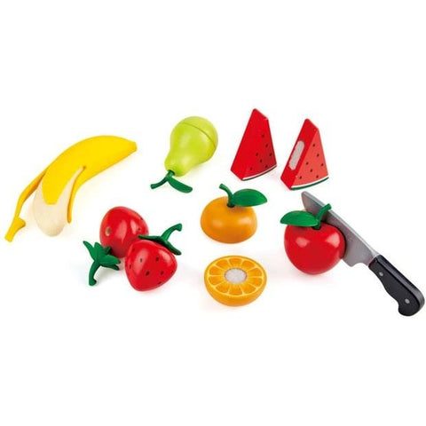 The HAPE Healthy Fruit Playset by HAPE includes a variety of fruits such as a peelable banana, pear, two strawberries, two apple pieces, two watermelon slices, an orange slice, a lemon, and an apple. It also comes with a realistic play knife. All items are brightly colored and made of plastic.