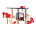Hape Gearhead Stunt Garage parking levels with pulley elevator and a toy car