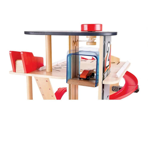 Hape Gearhead Stunt Garage parking levels with pulley elevator and a toy car