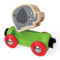 The Hape Jungle Journey Train by HAPE includes a wooden toy elephant with a gray body and a smiling face, attached to a green base with red wheels. This delightful component of the rail set brings joy to playtime with its simple design.