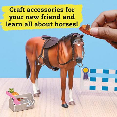 A person holds a small brown hat and comb in front of a toy horse with a saddle and reins. Next to the horse is a wooden box filled with mini grooming tools and a tiny carrot. Text above reads: "Craft accessories for your new friend, learn all about horse care, and enjoy our Klutz Wild About Horses model kit by KLUTZ!