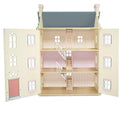 The LE TOY VAN Le Toy Van Cherry Tree Hall is a beautiful 4-storey wooden doll's house with a blue roof, beige exterior, and charming pink accents. Each floor features small rooms connected by staircases and decorated with light pink wallpaper. The open front doors reveal the delightful interior spaces.
