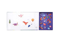 Dinosaur magnets arranged on the wipe-clean board with the mierEdu case