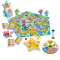 The Orchard Toys What a Performance Game is a colorful family board game set featuring a star-shaped spinner, character game pieces, various activity and trivia cards, a central performance board with a "Finish" space, a star-shaped timer, and a red die. The theme is vibrant and playful with cartoon characters.