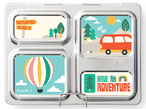 The Planetbox Launch Magnet by CAMELBAK is a customizable stainless steel lunchbox with four compartments, each featuring colorful drawings. The top left displays "This PlanetBox belongs to" text with trees, the top right showcases a red car near mountains, the bottom left presents a hot air balloon, and the bottom right has "Have an Adventure" text.