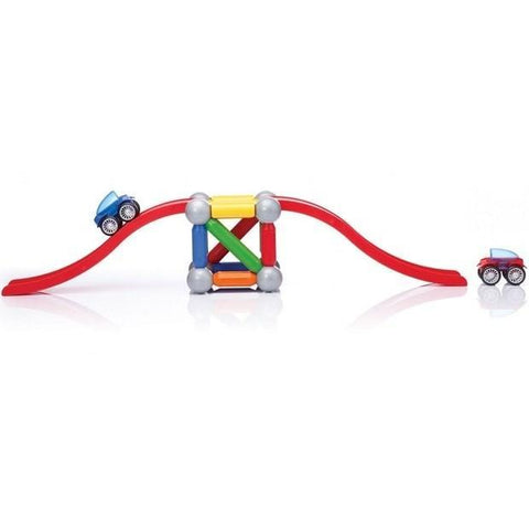 The SmartMax Basic Stunt Cars (46 pcs) by SmartMax features a curved red track with two small cars, one blue and one red, positioned on each end. At the center is a vibrant geometric structure made up of interlocking pieces that supports the track. The pieces are composed of red, yellow, green, and blue magnets for interactive play.