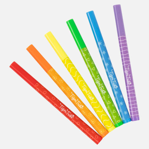 Six Tiger Tribe Window Markers by TIGER TRIBE are arranged in a fan shape. The colors from left to right are red, orange, yellow, green, blue, and purple. Each kid-safe marker has unique white patterns or designs on the barrel, adding a playful touch.